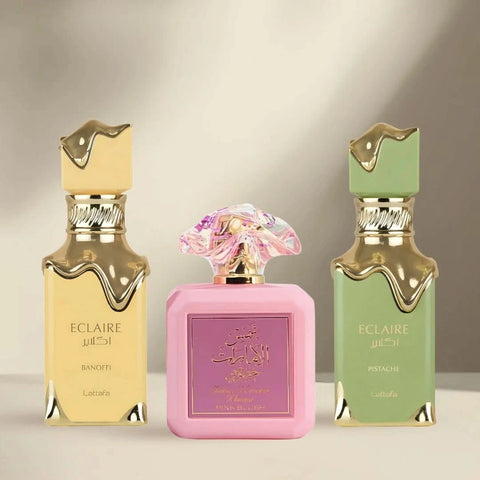 Bundle of Lattafa Eclaire Pistache, Eclaire Banoffi, and Pink Blush Eau de Parfum spray bottles, 100ml each, with colorful packaging.
