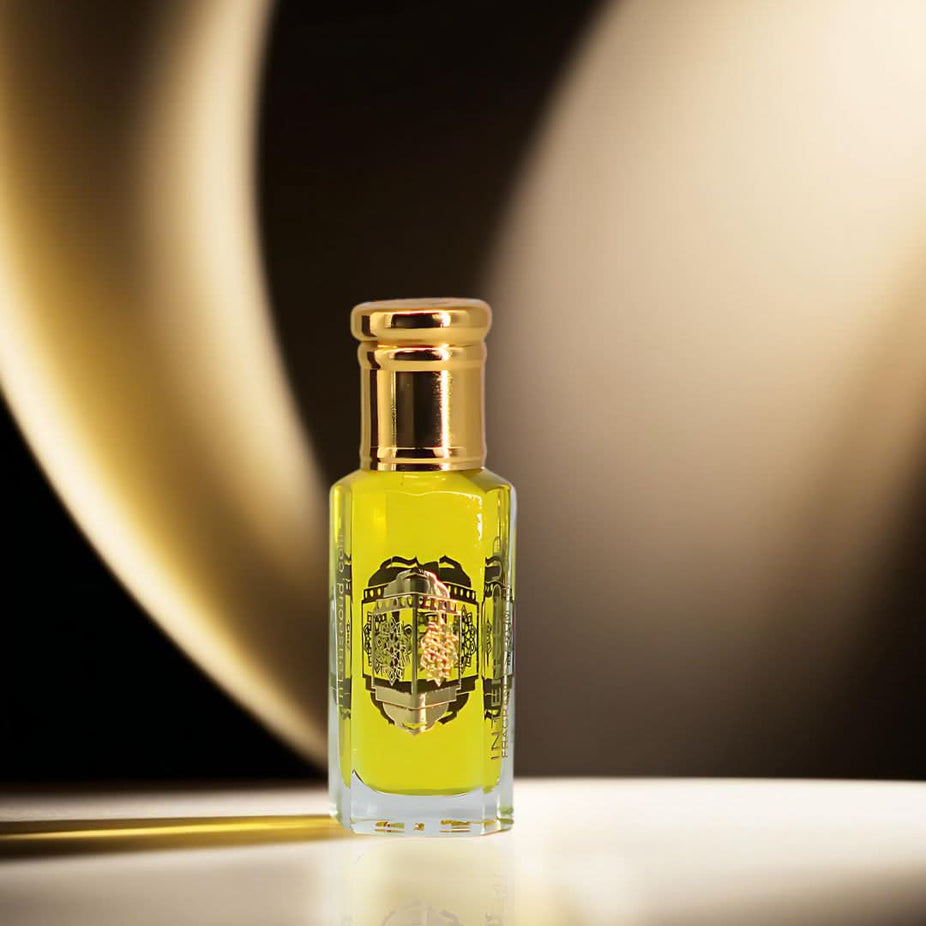 Intense Oud Gardenia Musk Perfume Oil 12ml in a black gift box, featuring a clear glass bottle with a rollerball applicator.