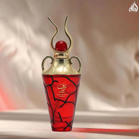 Lattafa Niche Emarati Taraf Eau De Parfum spray in 100ml velvet pouch, featuring elegant glass bottle and floral fragrance details.