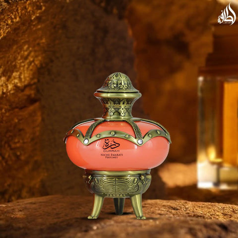 Lattafa Niche Emarati Durrah Eau De Parfum spray in 100ml bottle, elegant design with velvet pouch visible.
