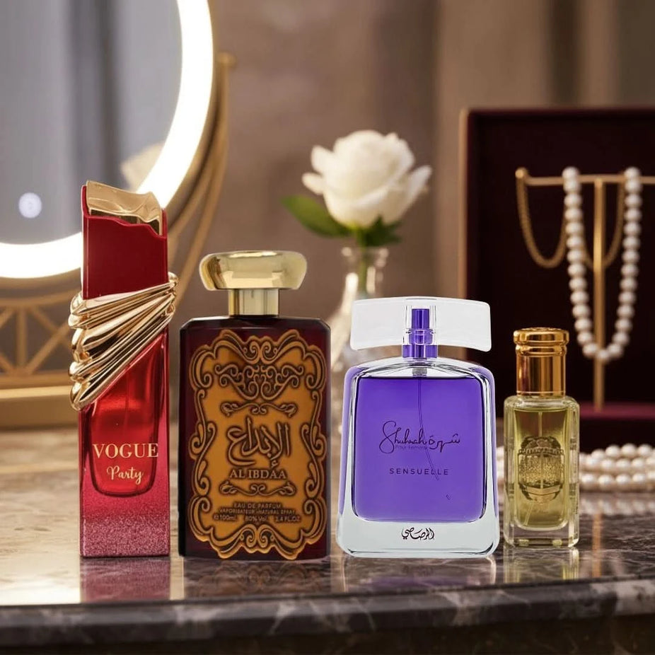 Assorted perfume bottles including Vogue by Maison Alhambra, Al Ibdaa Gold by Ard Al Zaafaran, Shuhrah Sensuelle by Rasasi, and Rouje oil.