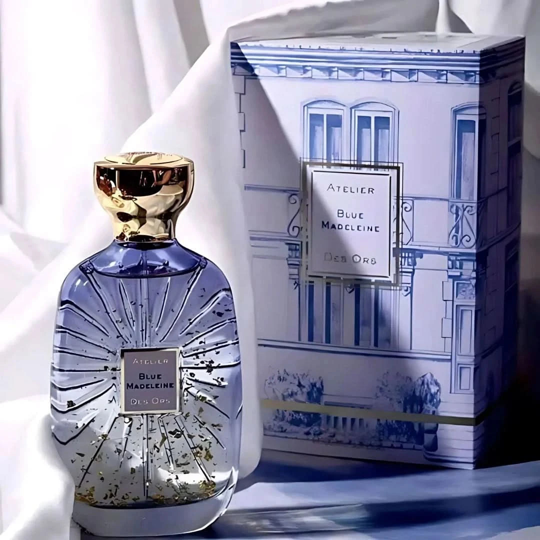 Blue Madeleine Eau de Parfum spray by Atelier Des Ores, featuring a sleek blue perfume bottle with elegant design.