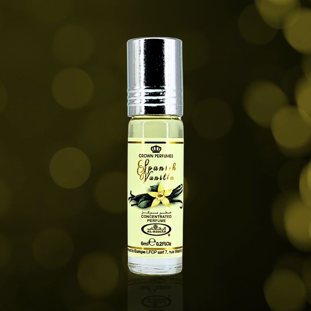 Set of six Al Rehab Spanish Vanilla concentrated perfume oil CPO bottles, each 6ml, with elegant packaging and branding visible.