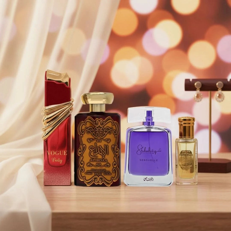 Bundle of four perfume products including Vogue, Al Ibdaa Gold, Shuhrah Sensuelle sprays, and Rouje perfume oil by Intense Oud.