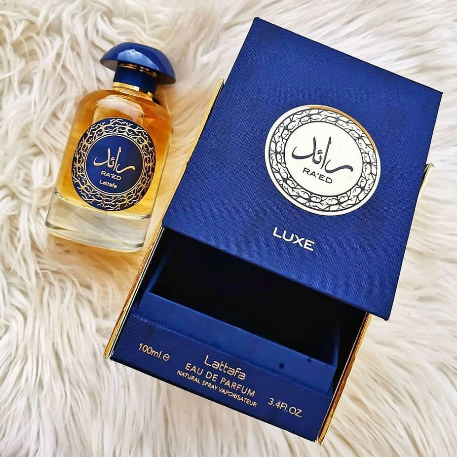 Lattafa Ra'ed Gold Luxe Eau De Parfum 100ML bottle with gold accents, elegant design and sophisticated appearance.