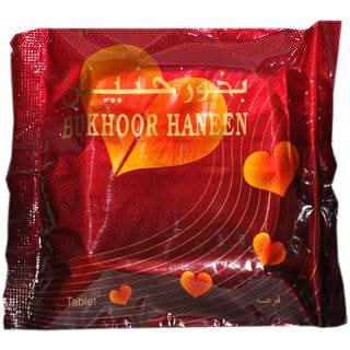 Al Haramain Haneen Bakhoor Tablet 45g with aromatic incense, showcasing the fragrant Bakhoor product on a white background.