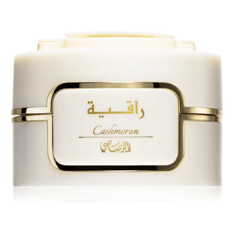 Rasasi Bakhoor Raqiya Cashmeran tablets, aromatic incense tablets in a clear container, used for home fragrance and perfuming.