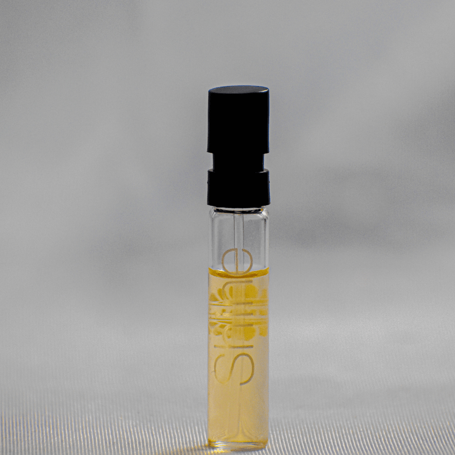 Ajmal Shine EDP sample for women, 1ML perfume vial with clear packaging, showcasing the fragrance sample by Ajmal.