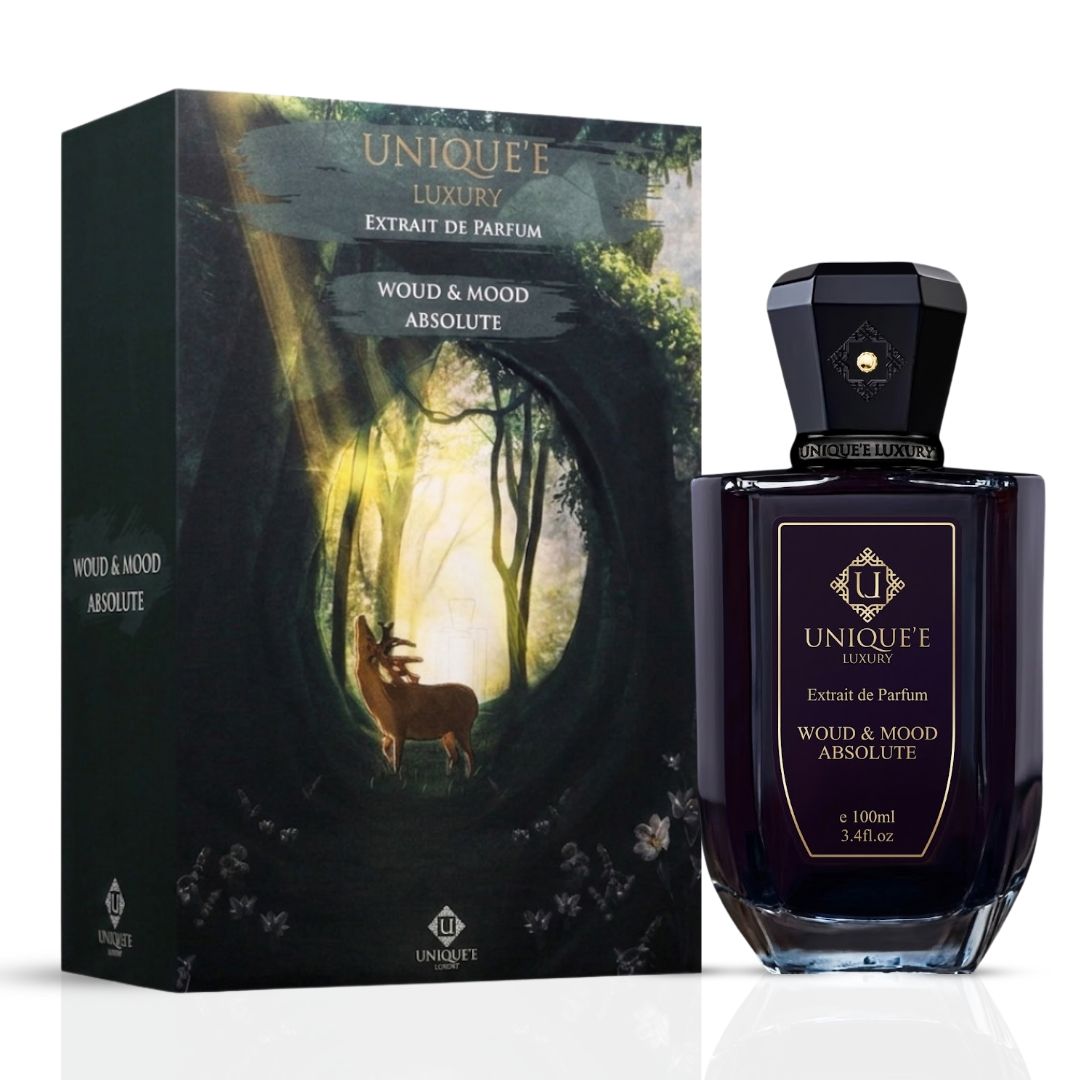 Unique'e Luxury Woud & Mood Absolute Extrait de Parfum 100ml EDP bottle with elegant design and floral accents.