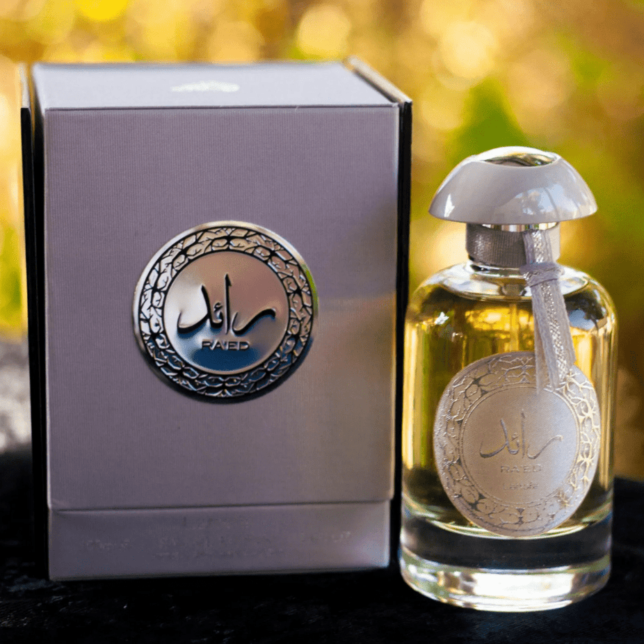 Ra'ed Silver Eau De Parfum spray by Lattafa, 100ml bottle, sleek silver packaging, elegant design, and fragrance cap.