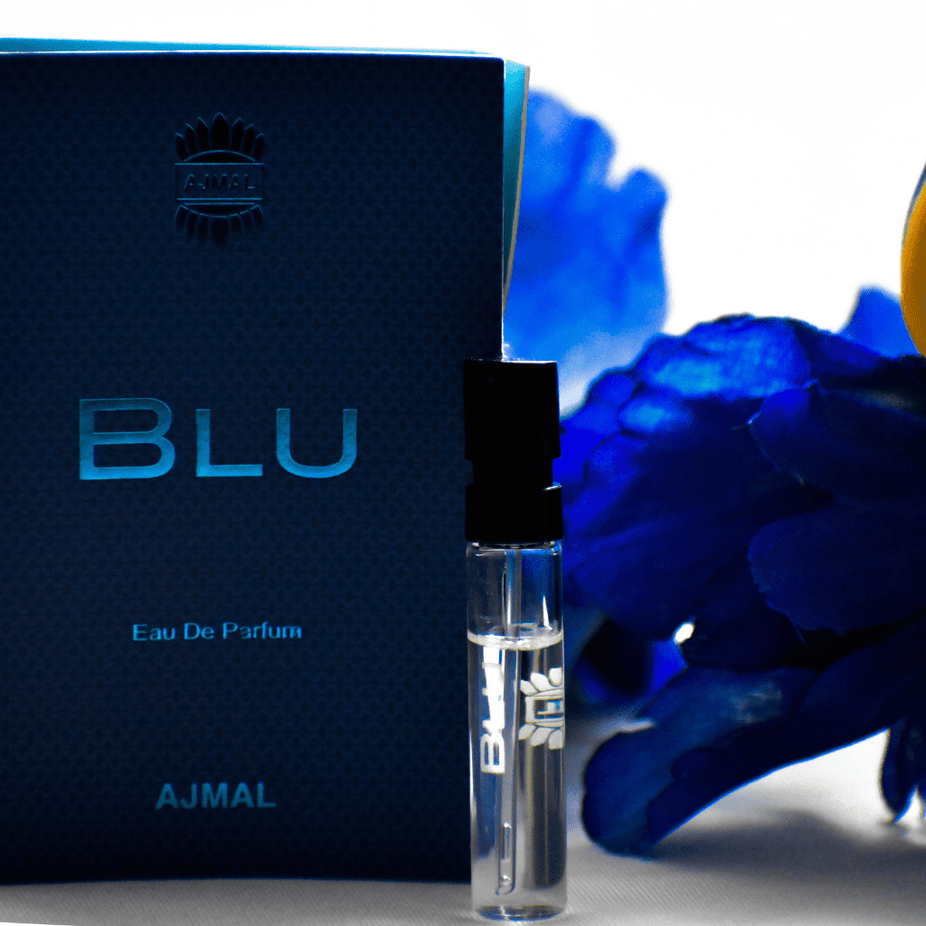 Small clear vial of Ajmal Blu EDP Men fragrance sample, 1ML size with black cap, displayed against a plain background.