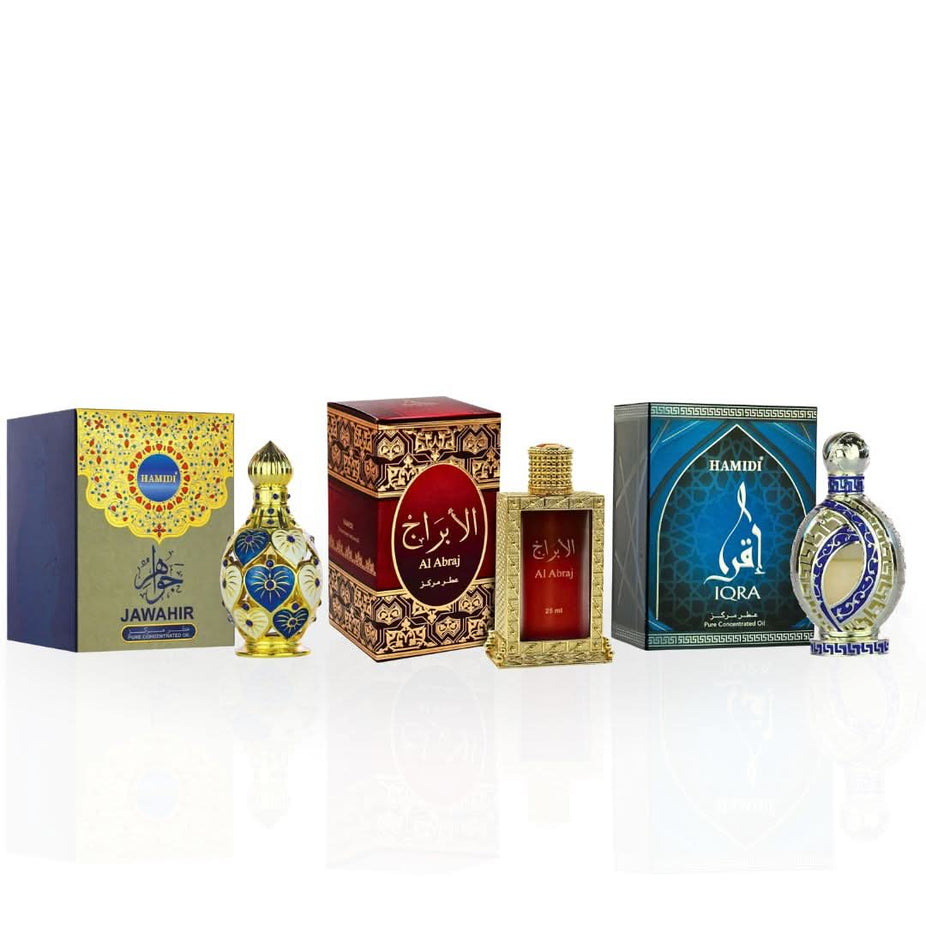 Hamidi Al Abraj Jawahir Iqra perfume oil collection with elegant bottles and ornate packaging on display.