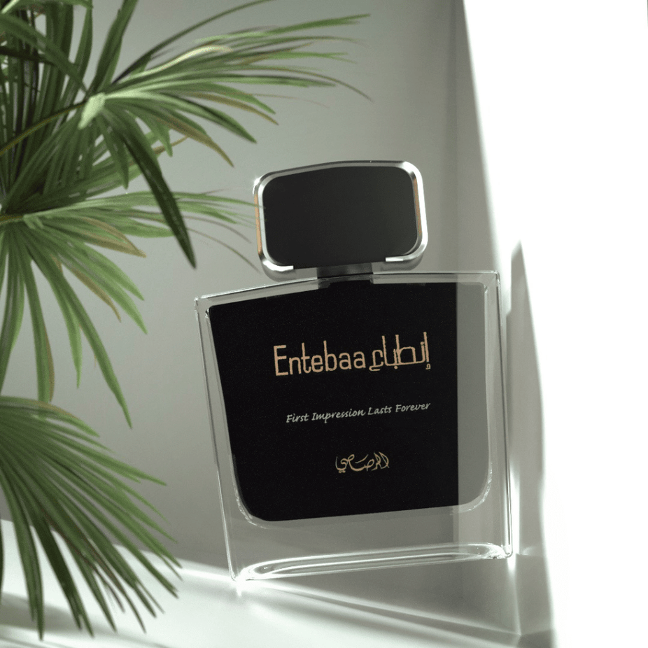 Entebaa EDP couple perfume set by Rasasi, 100ml bottles for men and women, featuring elegant packaging and stylish bottles.