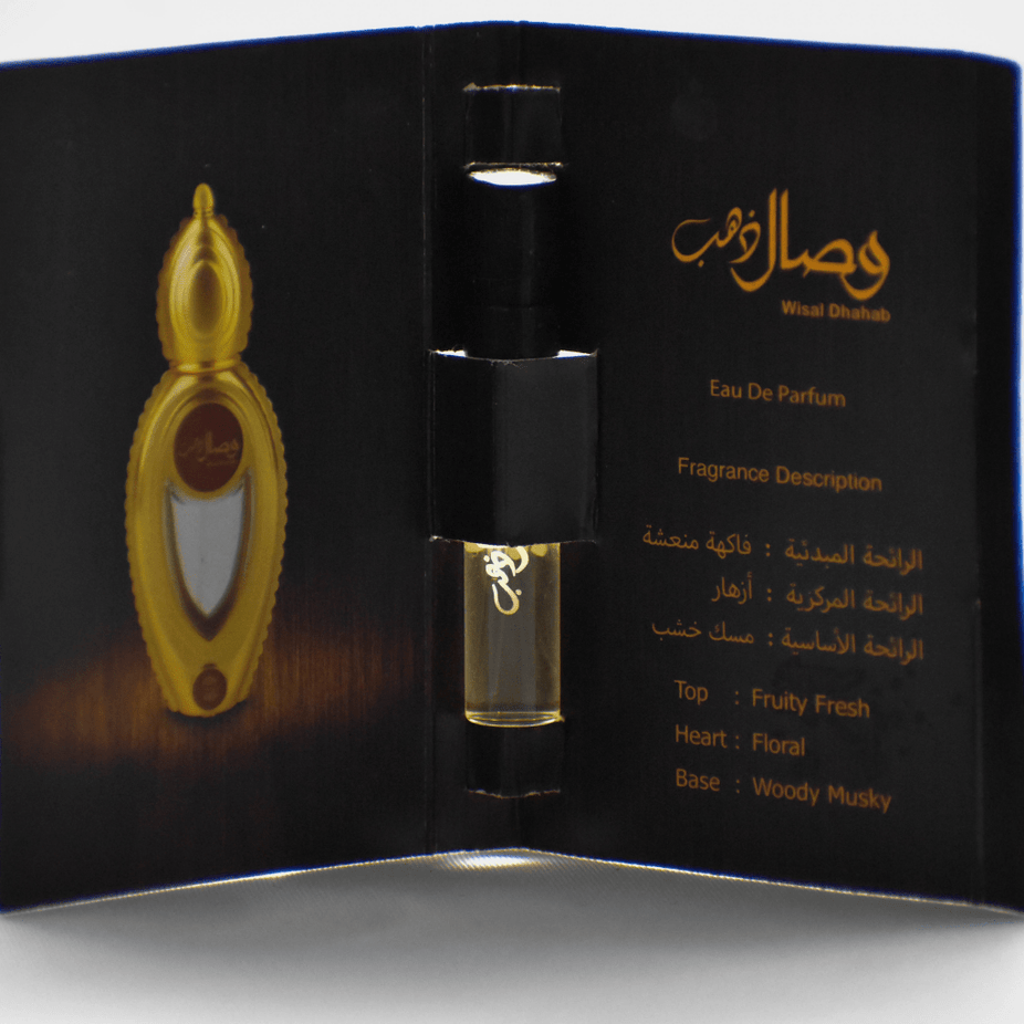 Ajmal Wisal Dhahab EDP sample bottle, unisex fragrance, 1ML size, with elegant packaging and branding visible.