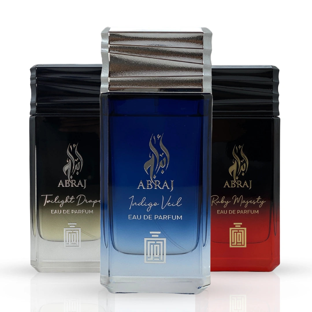 Aura Fragrances Abraj Twilight Drape, Ruby Majesty, and Indigo Veil Eau De Parfum Spray 100ml bundle bottles displayed.