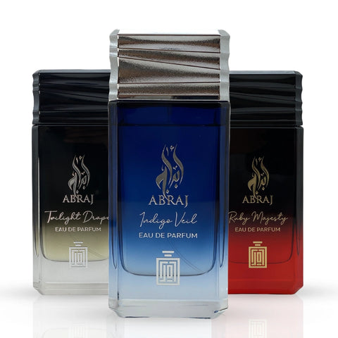 Aura Fragrances Abraj Twilight Drape, Ruby Majesty, and Indigo Veil Eau De Parfum Spray 100ml bundle bottles displayed.
