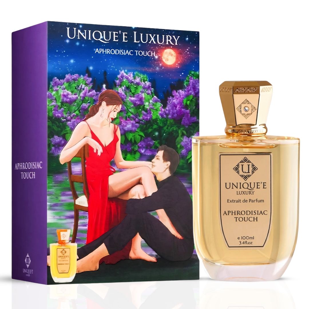 Aphrodisiac Touch Extrait de Parfum 100ml bottle by Unique'e Luxury, elegant glass bottle with silver accents and fragrance label.