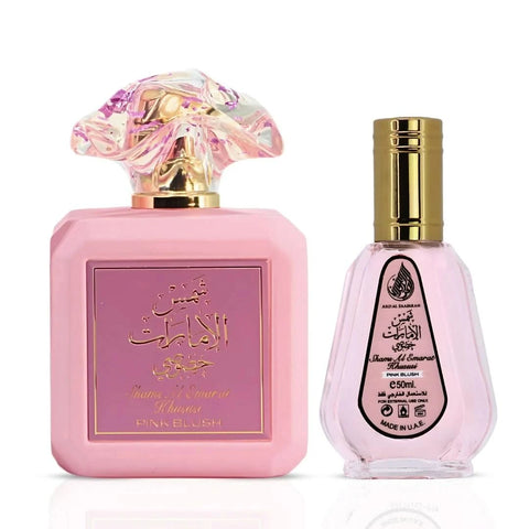 Pink Blush Shams Al Emarat Eau de Parfum by Ard Al Zaafaran in 100ml and 50ml bottles, featuring elegant glass bottles and pink accents.