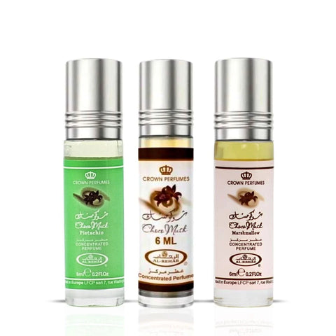 Al Rehab Choco Musk perfume oil bundle including marshmallow and pistachio scents, 6ml bottles with elegant packaging.