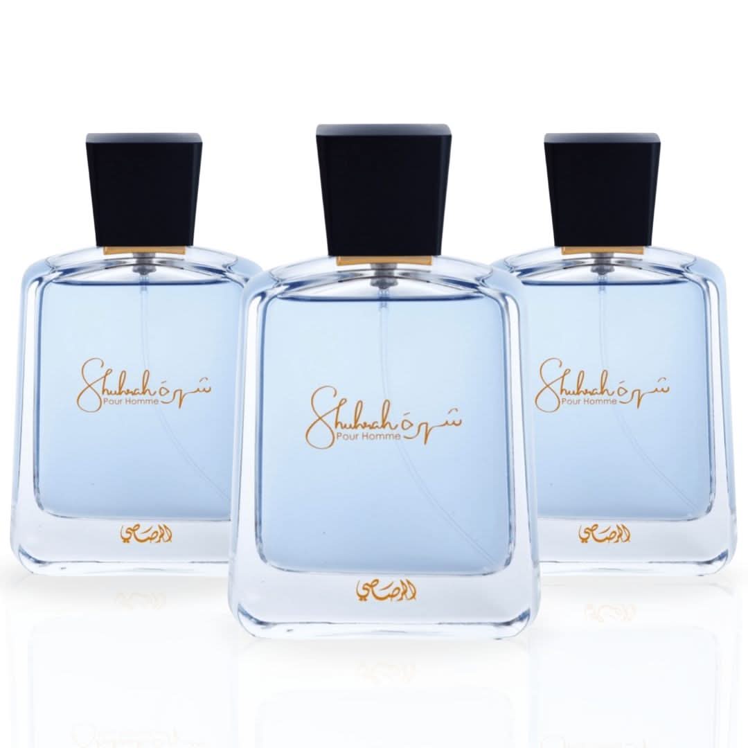 Three Rasasi Shuhrah Pour Homme Eau de Parfum Spray bottles, 90ml each, in a value pack, showcasing sleek black bottles.