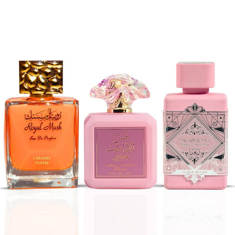 Intense Oud bundle of three 100ml Eau de Parfum sprays including Pink Blush by Ard Al Zaafaran, Noble Blush by Lattafa, and Caramel Toffee by Surrati.