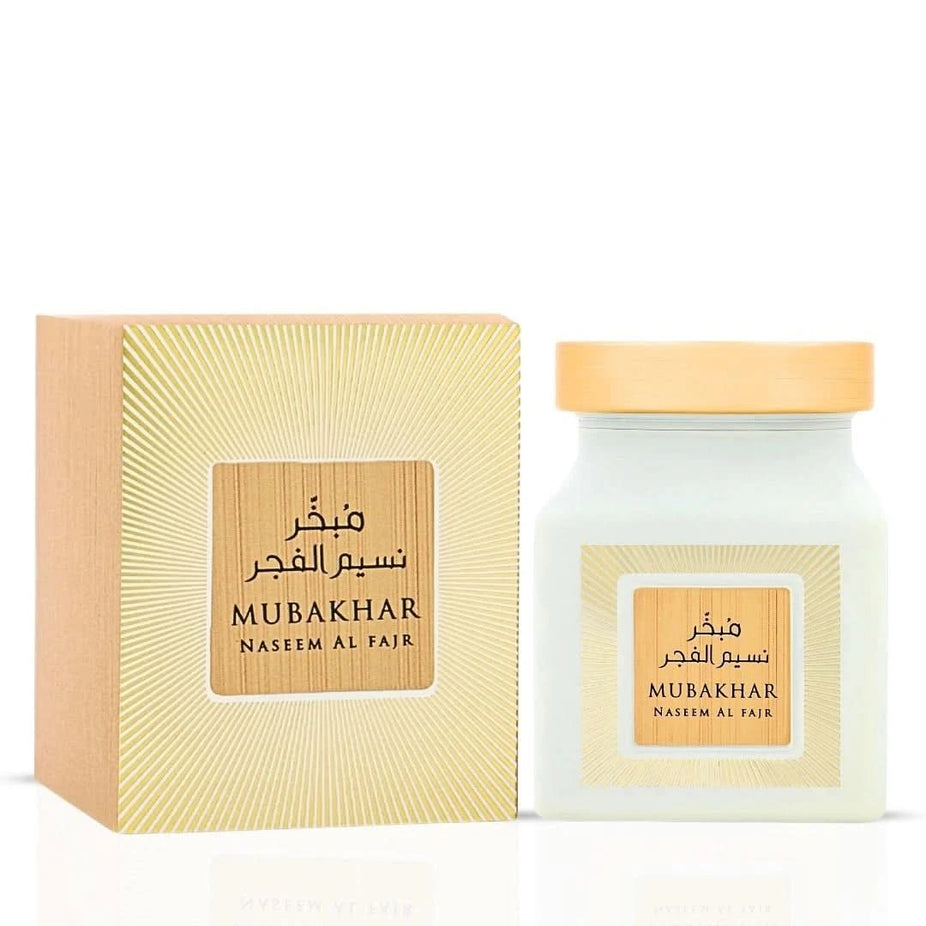 Rasasi Mubakhar Naseem Al Fajr Oudh Moattar Bakhoor 50g in a decorative container with fragrant oudh and traditional packaging.