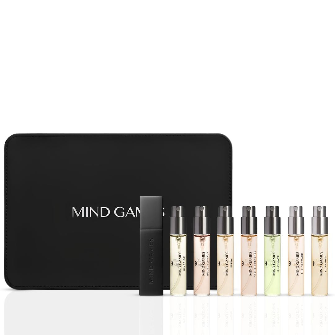 Mind Games Olfactive Amber 7-piece discovery set with seven 7.5ml perfume vials arranged in a display collection.