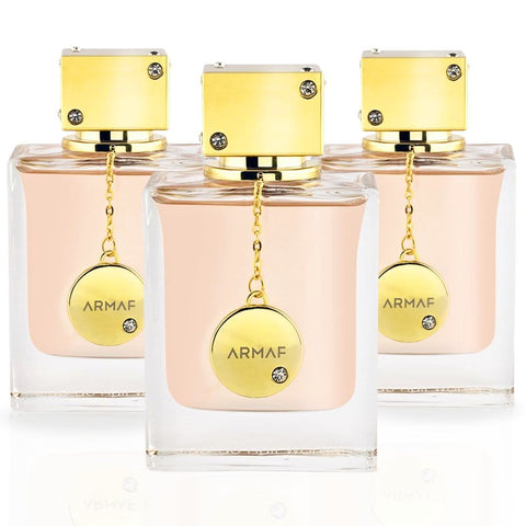 Armaf Club De Nuit Women Eau de Parfum Spray 105ml in a value pack of three bottles, featuring elegant perfume bottles.