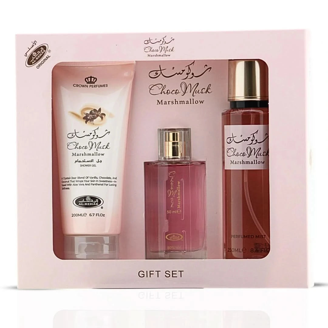 Al Rehab Choco Musk Marshmallow perfume gift set with three bottles, featuring elegant packaging and floral and chocolate scent themes.