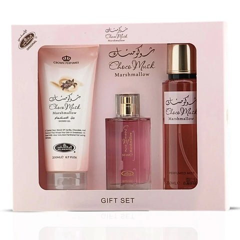 Al Rehab Choco Musk Marshmallow perfume gift set with three bottles, featuring elegant packaging and floral and chocolate scent themes.