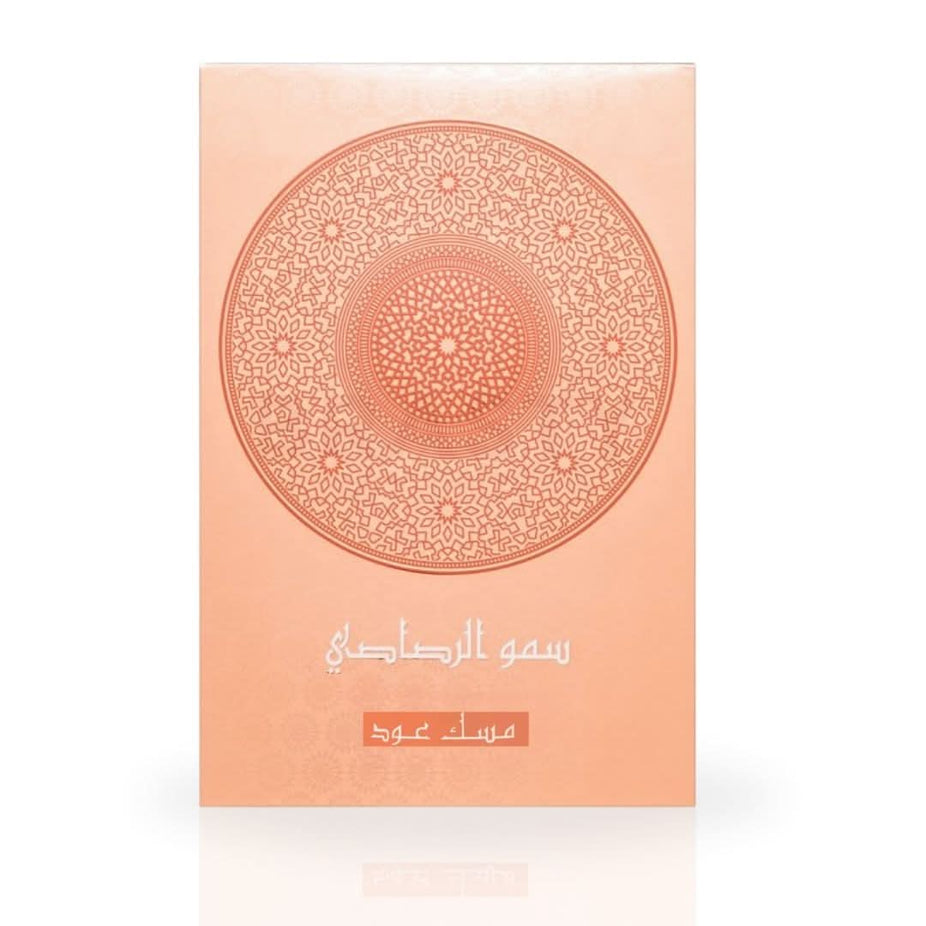 Rasasi Somow Al Rasasi Musk Oud Eau de Parfum spray bottle, 100ml, with elegant packaging and fragrance details visible.