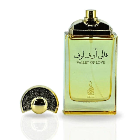 RISALA Valley Of Love Eau de Parfum spray 100ml in a velvet pouch, featuring a luxurious fragrance bottle with elegant design.