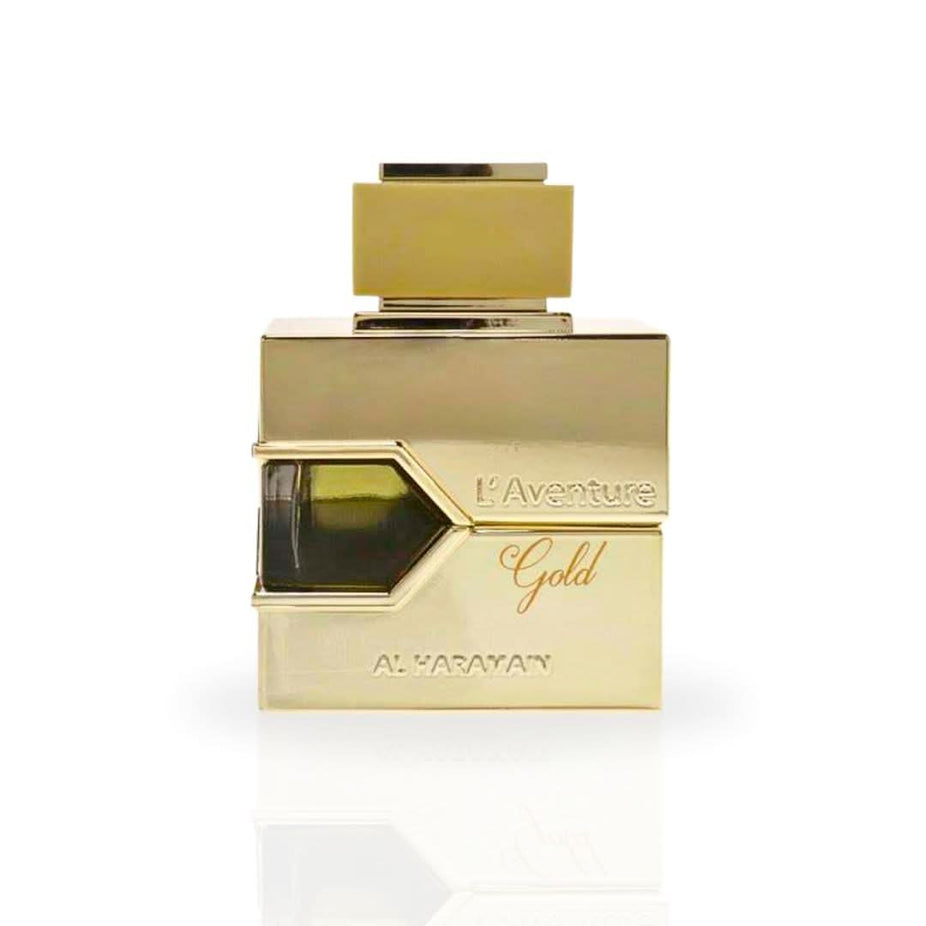 Al Haramain L'Aventure Gold EDP spray 100ml bottle with floral design, showcasing the luxurious feminine perfume.
