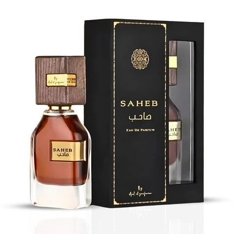 Bundle of Intense Oud Saheb Eau de Parfum spray 70ml and Mukhallat Al Zafran perfume oil 12ml, featuring elegant bottles.