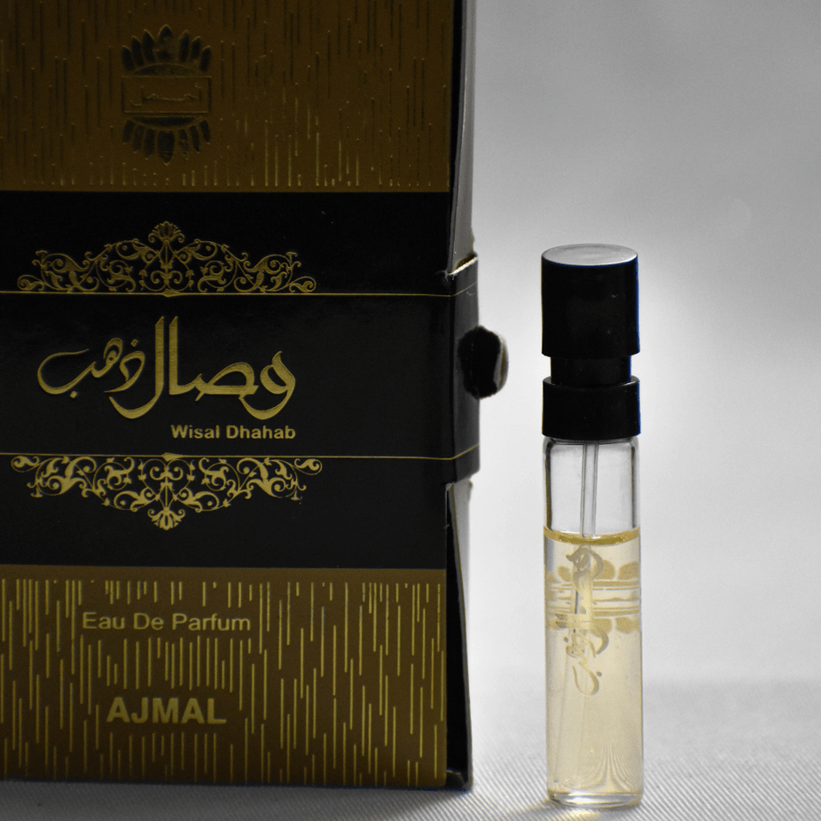 Ajmal Wisal Dhahab EDP sample bottle, unisex fragrance, 1ML (0.05 oz), with silver cap and clear label showing product details.