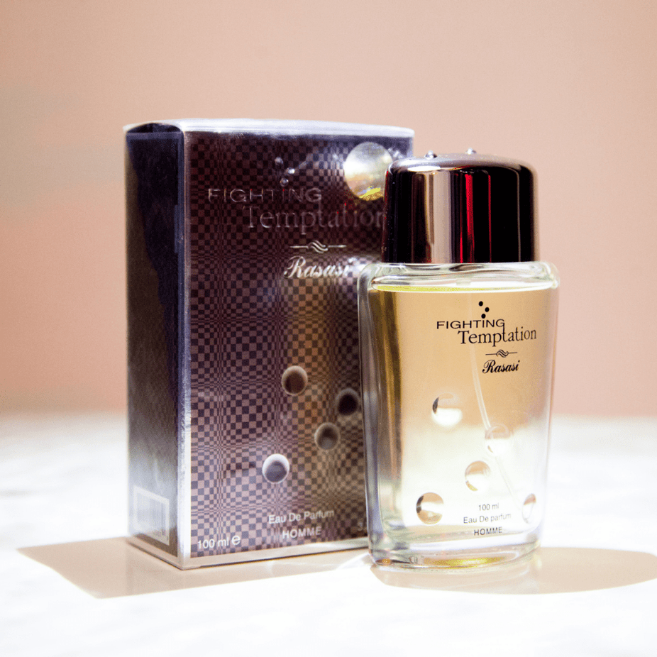Rasasi Fighting Temptation EDP 100ML Eau De Parfum bottle with elegant packaging and floral fragrance elements.
