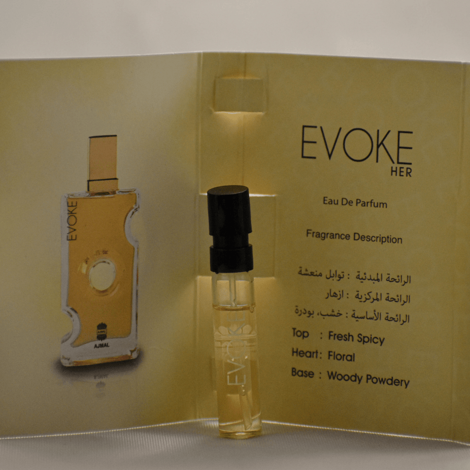 Small clear vial of Ajmal Evoke EDP sample for women, showing the 1ML fragrance sample with a white label and cap.