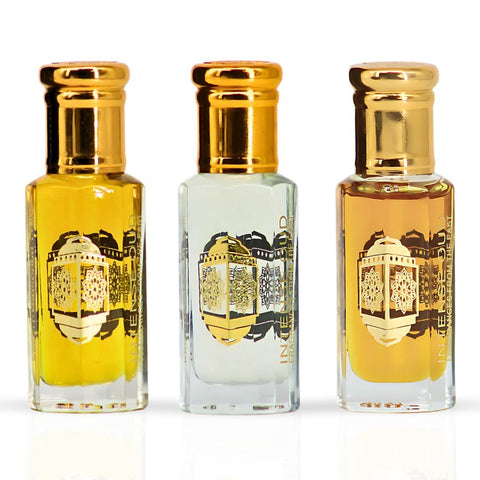 Bundle of Fawaken Crushed & Noble Fruits perfume oils in 12ml bottles by Intense Oud, displayed in a black gift box.