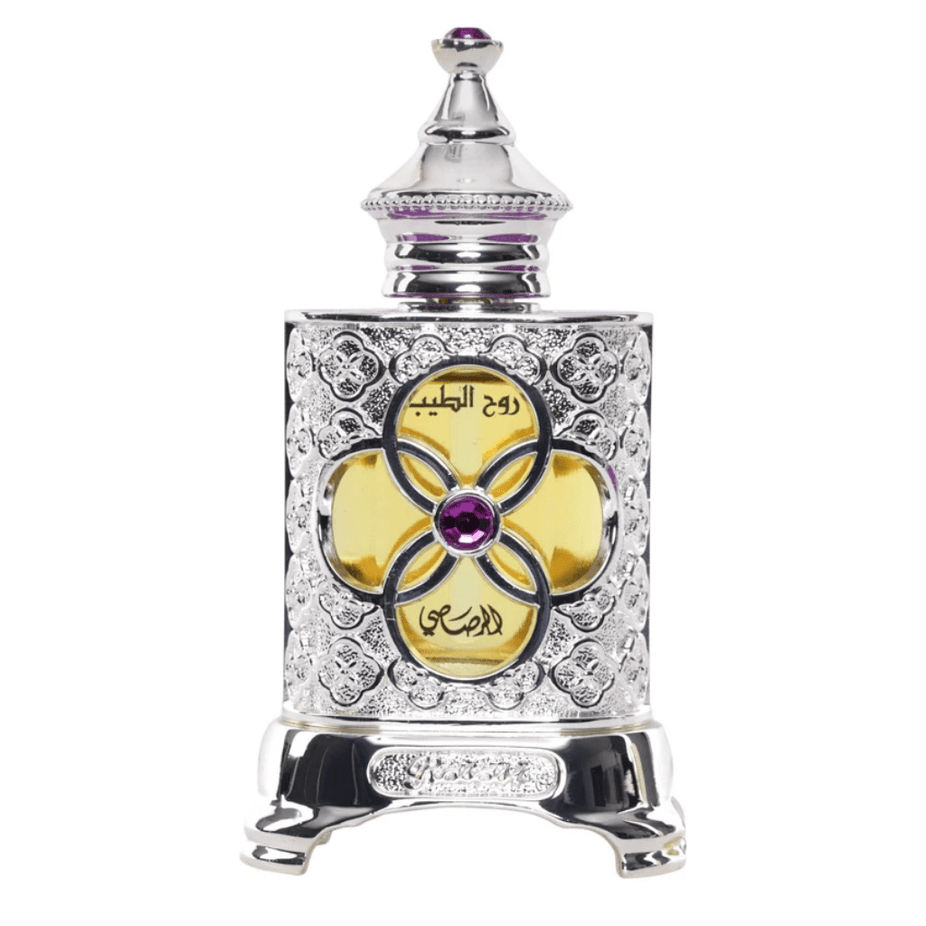 Rasasi Ruh Al Teeb concentrated perfume oil in a 15ML bottle, showcasing the elegant packaging and dark glass container.