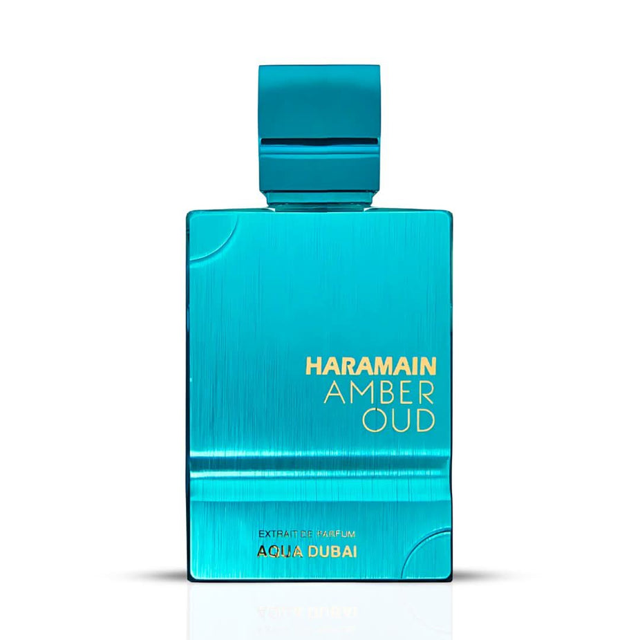 Amber Oud Aqua Dubai Extrait de Parfum spray by Al Haramain, featuring a sleek 100ml bottle with amber and oud accents.