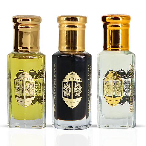 Bundle of Intense Oud Noble Fruits Bloom & Aphrodisiac perfume oils in 12ml bottles with black gift box, elegant and luxurious presentation.
