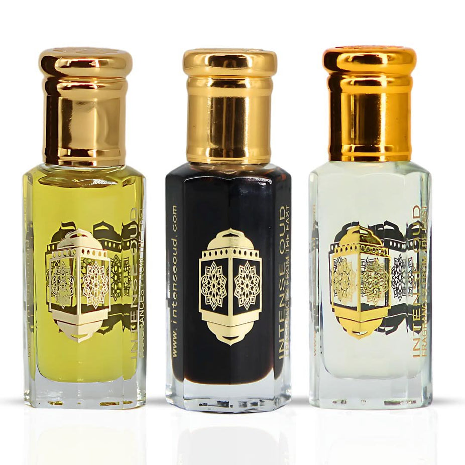 Bundle of Intense Oud Noble Fruits Bloom & Aphrodisiac perfume oils in 12ml bottles with black gift box, elegant and luxurious presentation.