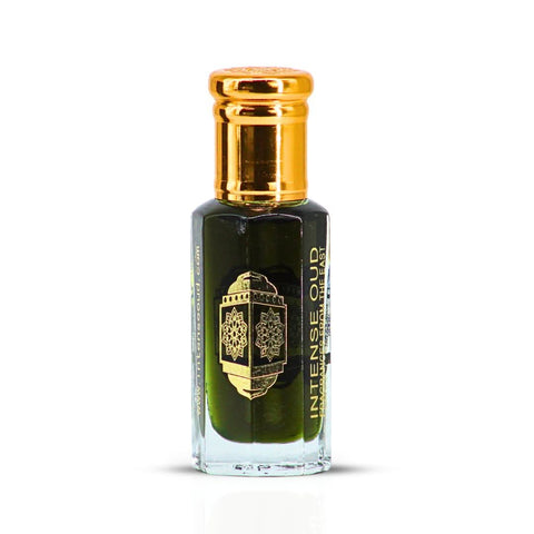 Jannet El Firdaus Perfume Oil by Intense Oud in a 12ml bottle, displayed with a black gift box and loose oil in a glass container.