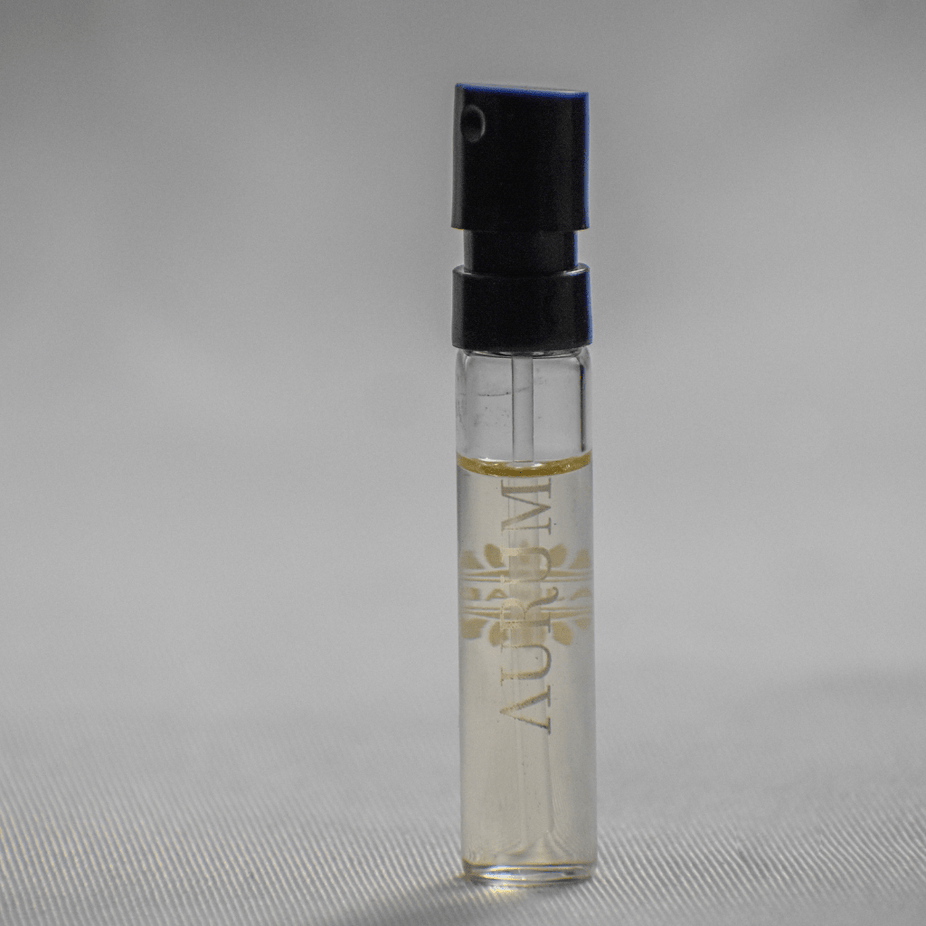 Aurumm EDP sample for women by Ajmal, 1ml size, featuring elegant perfume bottle and packaging for testing or gifting.