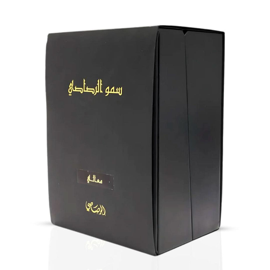 Rasasi Somow Al Rasasi Ma’ali Oudh Moattar Bakhoor 50g, fragrant wood and herbal blend in decorative container.