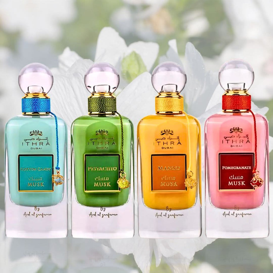 Set of four Ard Al Zaafaran Pomegranate, Pistachio, Mango, and Cotton Candy Musk Eau De Parfum sprays in 100ML bottles.