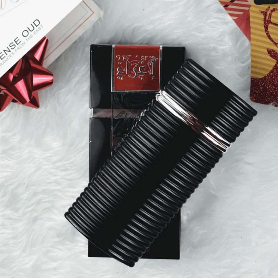 Rasasi Egra EDP couple set with 100ml bottles for men and women, featuring elegant packaging and floral fragrance details.