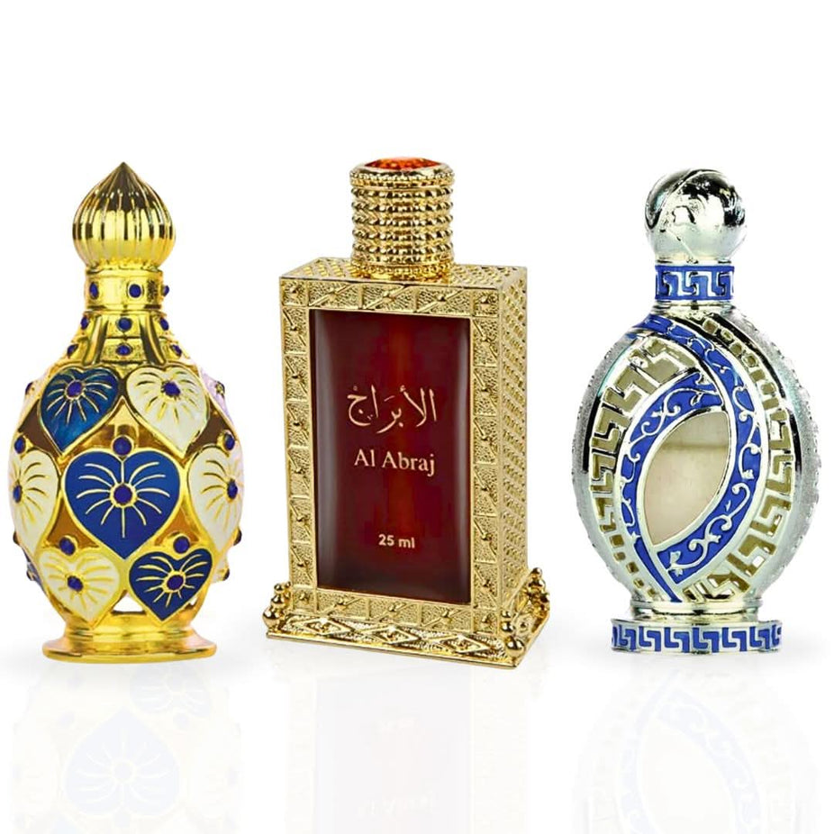 Collection of Hamidi Al Abraj Jawahir Iqra Perfume Oils featuring elegant bottles with intricate designs in a luxurious display.