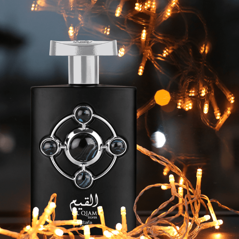 Al Qiam Silver Eau De Parfum by Lattafa Pride, 100mL bottle with sleek silver packaging, showcasing elegant perfume design.