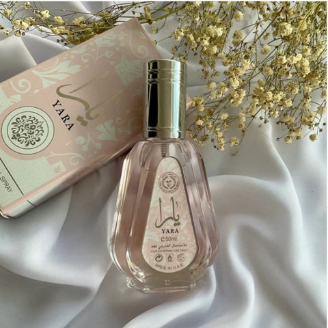 Three bottles of Ard Al Zaafaran Yara Eau de Parfum Spray 50ml in a value pack, featuring elegant perfume bottles with floral accents.
